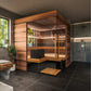 Thermasol Astra indoor sauna with warm wood exterior, glass door, interior bench seating, and wooden floor mat in modern bath