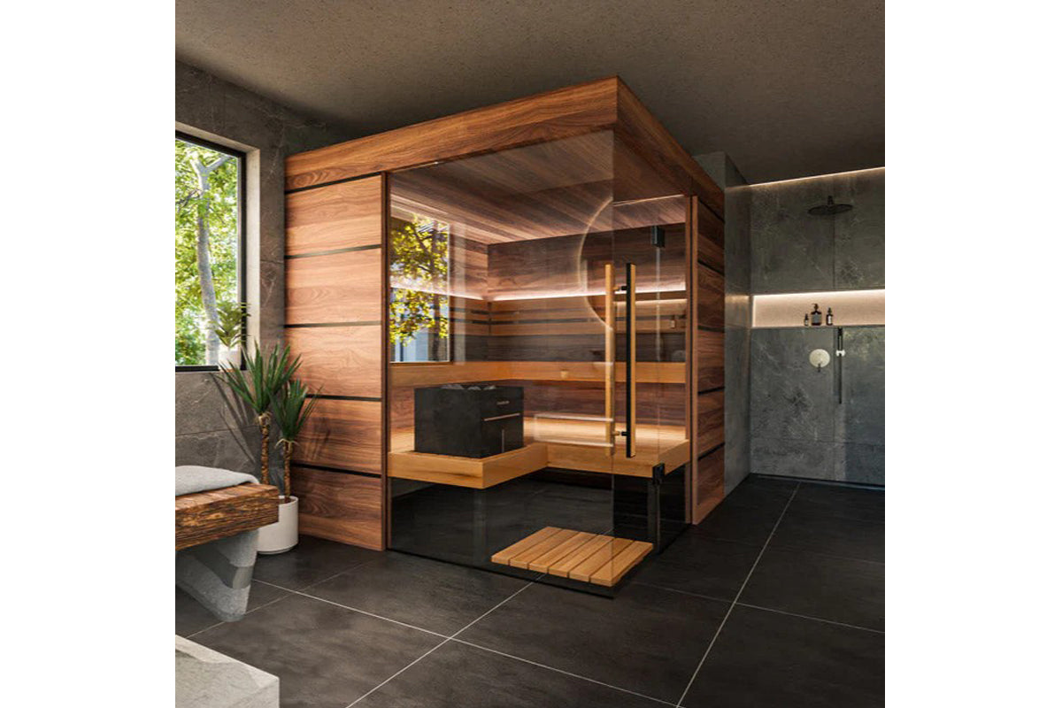 Thermasol Astra indoor sauna with warm wood exterior, glass door, interior bench seating, and wooden floor mat in modern bath