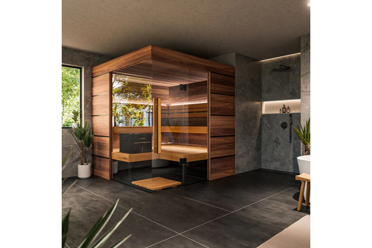 Thermasol Astra indoor sauna with warm wood exterior, glass doors, and bench seating in modern bathroom setting