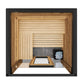 Thermasol Fortis outdoor sauna with cedar wood interior, horizontal and vertical paneling, black stone accent wall, and sauna