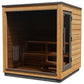 Cedar wood outdoor sauna with dark glass front panel, black metal roof, and interior wooden benches, shown on white backgroun