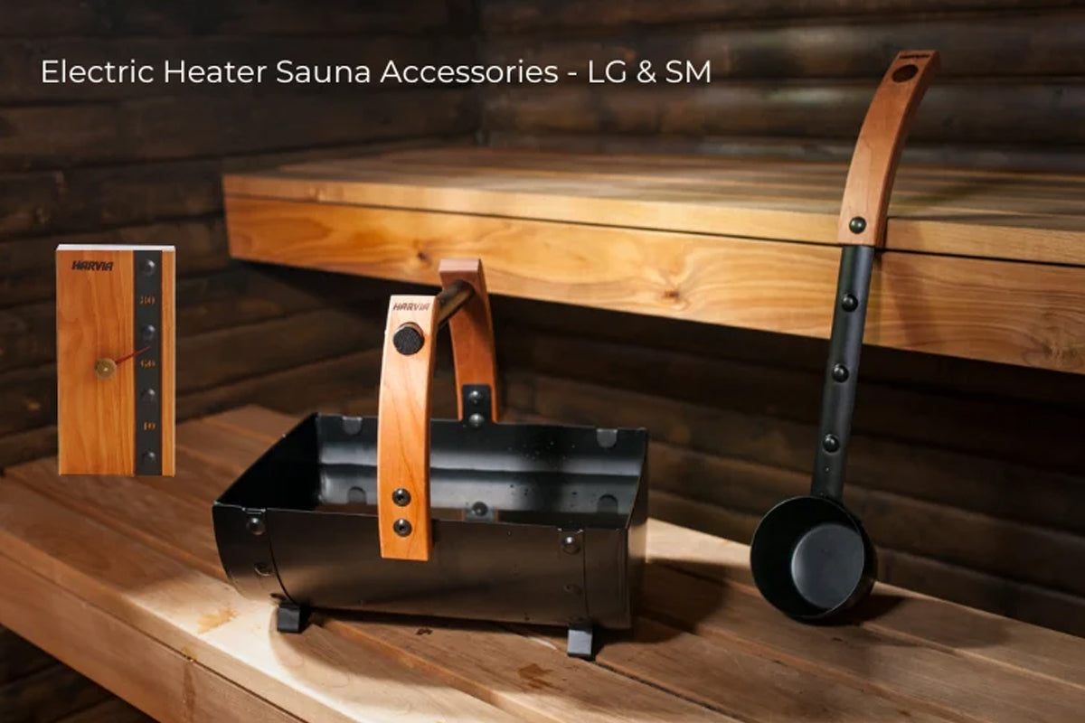 Electric sauna heater accessories set with wooden control panel, black metal bucket with wooden handles, and metal ladle on w