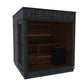 Black outdoor sauna with glass front door, wooden interior bench seating, and amber lighting on white background