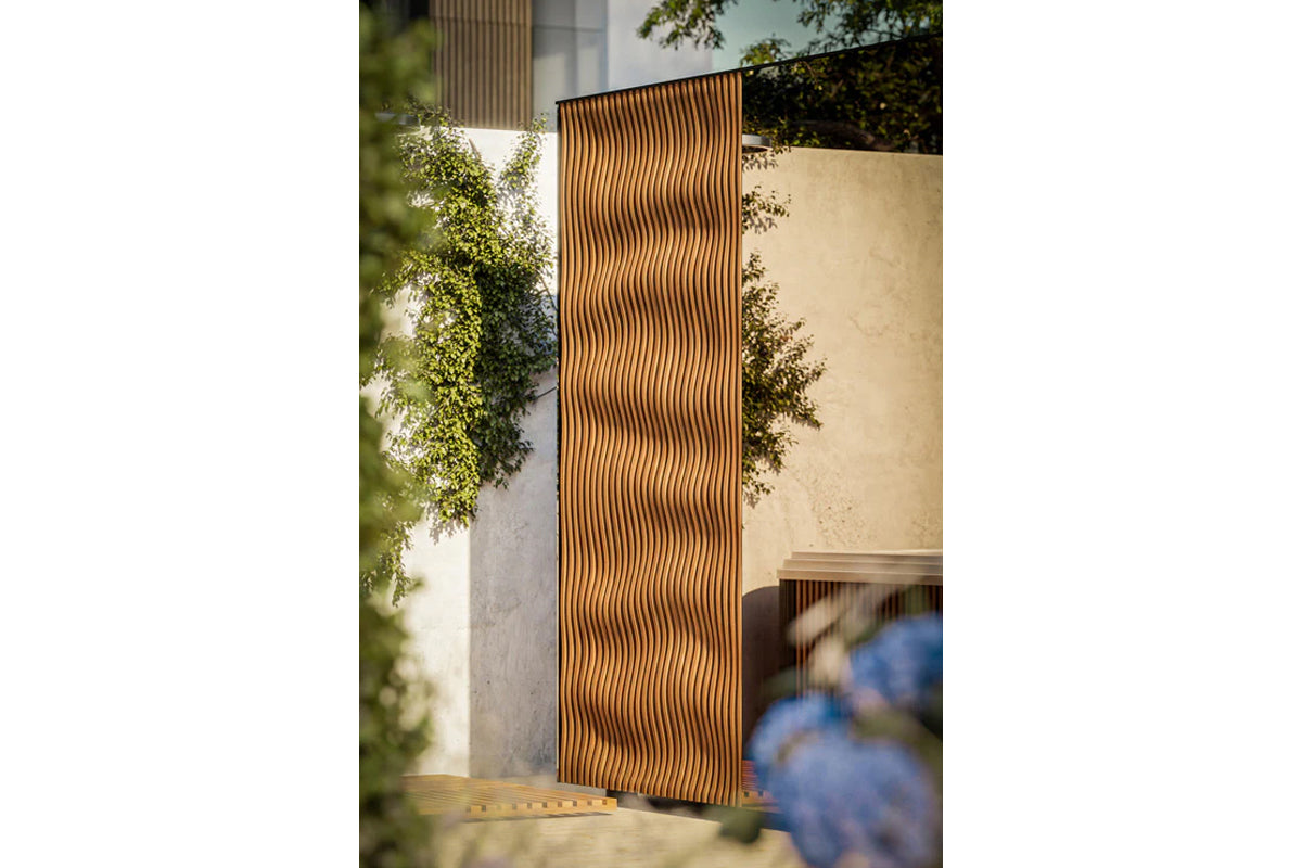 Thermasol Ombra outdoor sauna with vertical wood slat design in natural wood tone, displayed in modern architectural courtyar