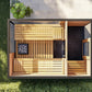 Overhead view of modern outdoor sauna with light wood slatted interior, black accent wall, glass door, and metal frame surrou