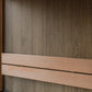 Thermasol Solaris outdoor sauna exterior detail showing dark wood-grain paneling with natural wood trim and glass window open