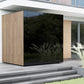 Modern outdoor sauna with natural wood slat siding and black glass corner panel on concrete patio