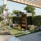 Modern outdoor sauna with black frame and wood interior door in landscaped garden setting with flowering vines and pergola