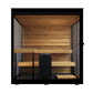 Black framed outdoor sauna with cedar wood interior, bench seating, and central heater stove, front view on white background