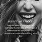 Woman smiling with long dark hair in black and white, promoting mood-boosting benefits of sauna sessions