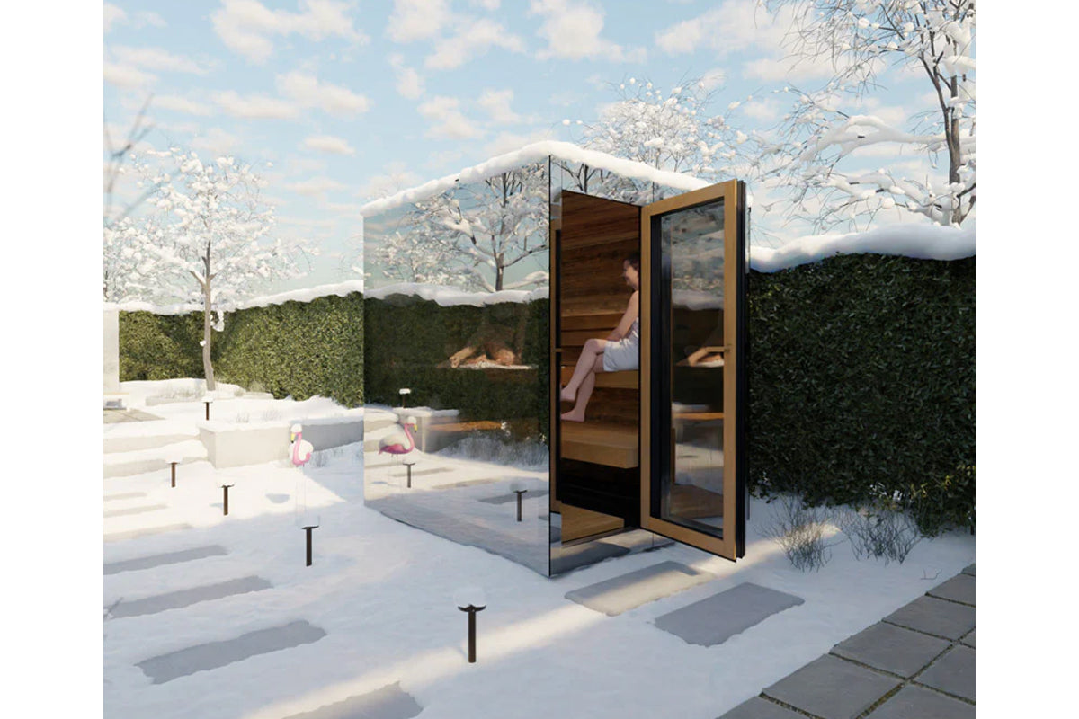 Modern outdoor sauna with wood interior, glass doors, and black metal frame in snowy winter setting