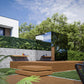 Thermasol Vue outdoor sauna with wood slat exterior, glass panel door, and black metal frame in modern garden setting