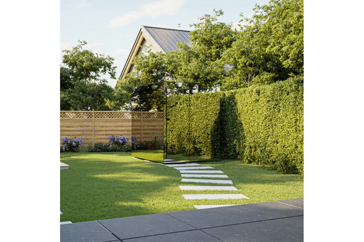 Thermasol Vue outdoor sauna with glass panels in modern backyard setting surrounded by green hedges and lawn