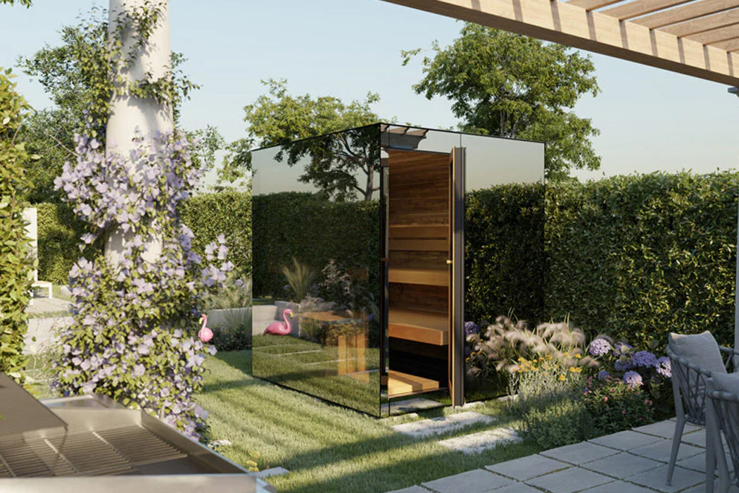 Modern outdoor sauna with glass and wood panels, black metal frame, wooden interior, set in garden with purple flowering vine