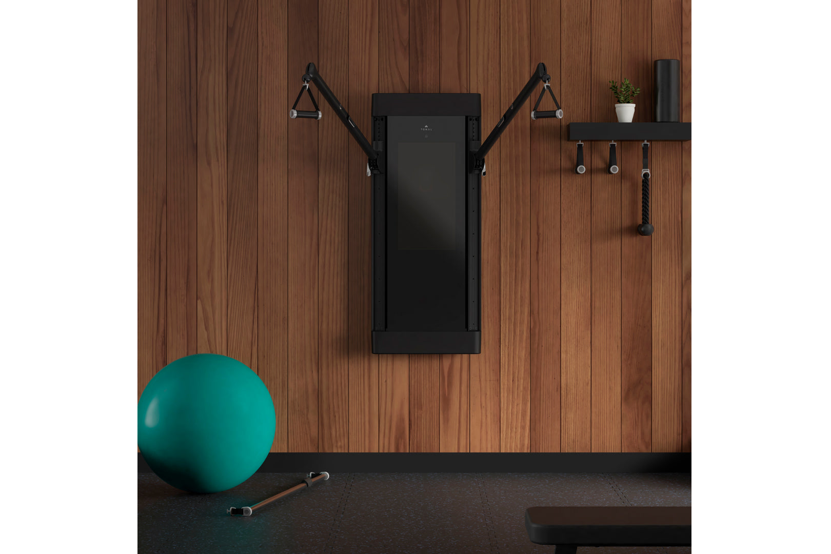 Black wall-mounted smart home gym with adjustable cable arms on wood plank wall, displayed in home gym setting with teal exer