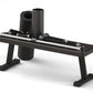 Black Tonal 2 smart home gym with storage bench, featuring rolled resistance bands, cylindrical storage container, and resist