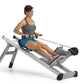 Woman using gray and black Total Gym Row Trainer exercise machine, wearing gray tank top and blue shorts, on white background