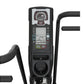 Black exercise air bike with digital display screen showing rate and metrics, analog gauge, start/stop buttons, and curved ha