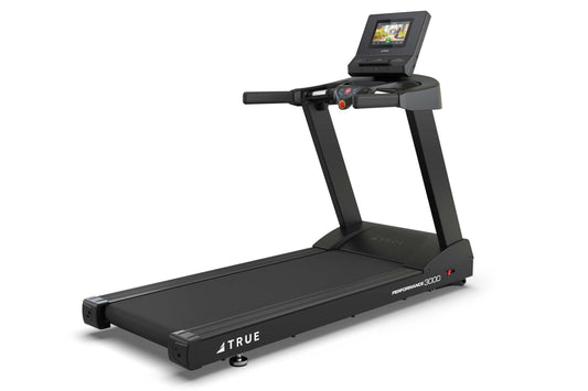 Black TRUE Performance 3000 treadmill with digital console display, handlebar controls, and cushioned running belt on white b