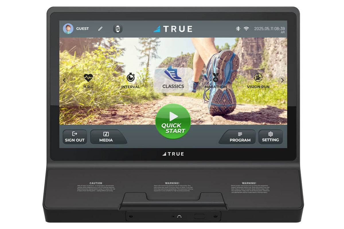 True Performance 3000 treadmill with black frame and digital display screen showing running workout interface and trail lands