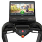 Black treadmill with dual handles, center control console featuring red stop button, and digital display screen showing runni