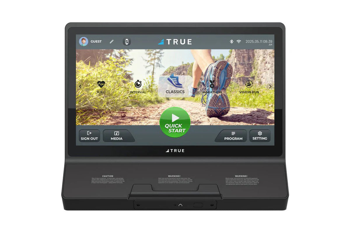 TRUE Performance 8000 treadmill with black base and display screen showing running shoe on trail with workout program options