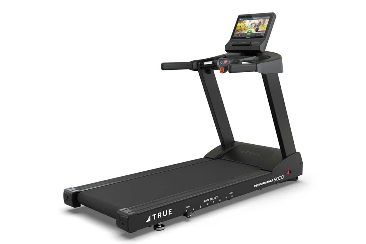 Black TRUE Performance 8000 treadmill with digital touchscreen console, control panel, and running deck on white background