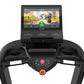 True Performance 8000 treadmill with black frame, dual handles with white grips, and console display showing running trail wo