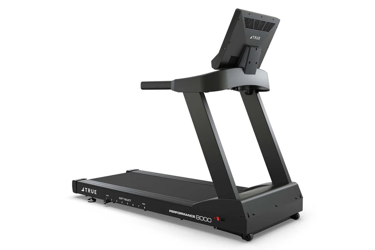 TRUE Performance 8000 black treadmill with digital console, gray handrails, and control panel on white background