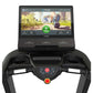 Black TRUE treadmill with display screen showing hiking trail interface and control console with directional buttons and red 