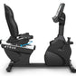 Black recumbent exercise bike with mesh backrest, digital console, and adjustable seat on white background
