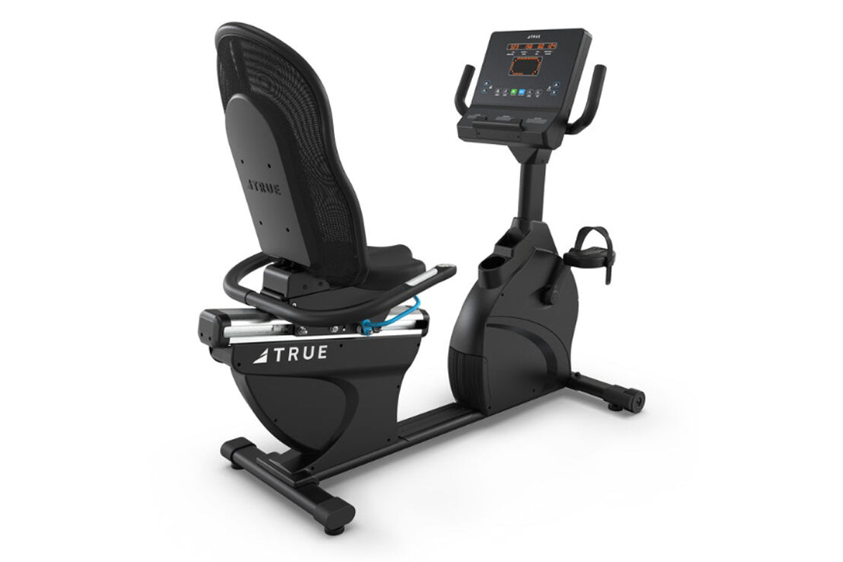 Black recumbent exercise bike with mesh backrest, digital display console, and foot pedals, shown on white background