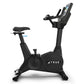 True Performance Series upright exercise bike with black frame, digital display console, padded seat, and handlebars on white
