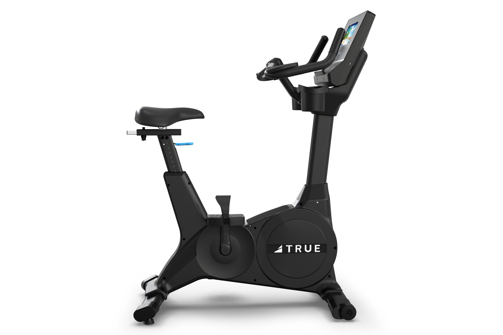 True Performance Series upright exercise bike with black frame, digital display console, padded seat, and handlebars on white