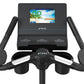 Black TRUE upright exercise bike with mounted tablet display showing GO Quick Start app and dual chrome and black handlebars,