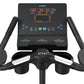 TRUE Performance Series upright exercise bike with black frame, digital display showing workout metrics in orange text, and h