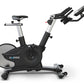 Surge black and silver upright exercise bike with curved flywheel, adjustable seat and handlebars, digital console, on white 