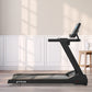 TRUE Z500 black treadmill with digital display and tablet holder, positioned in modern room with white paneling