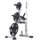 TuffStuff Olympic plate tree and bar holder with silver steel frame holding three black weight plates and barbell bars on whi