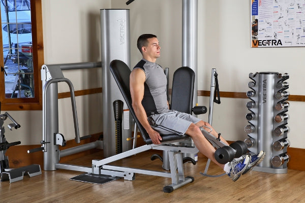Man using Vectra On-Line 1450 home gym leg press machine in fitness studio setting