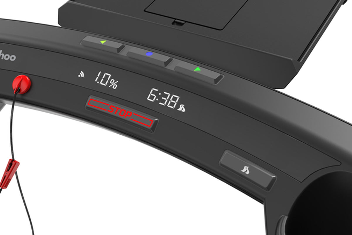 Black KICKR RUN smart treadmill with red cable attachment, LED display showing battery percentage and time, status indicator 