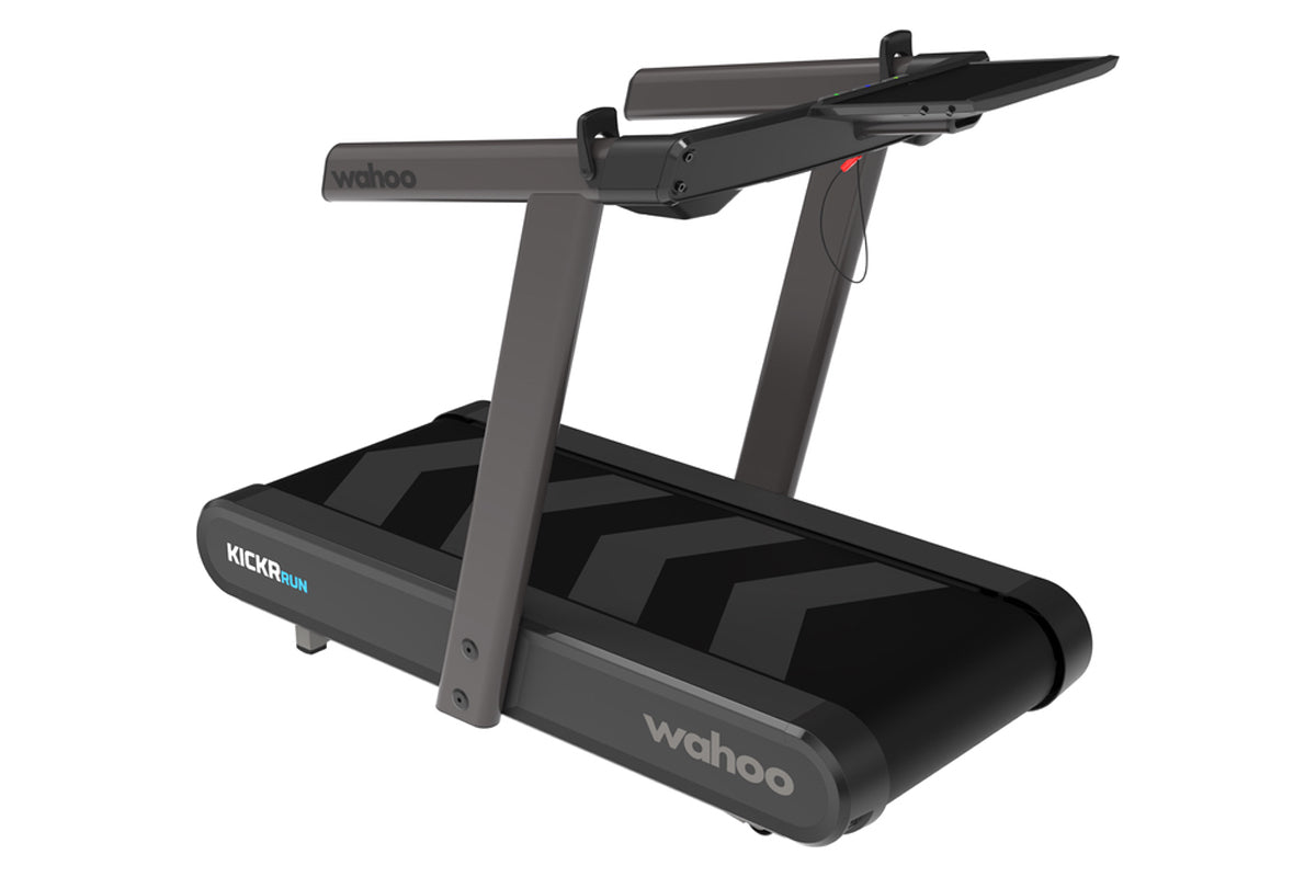 Wahoo Kickr Run smart treadmill with dark gray frame, black belt, dual handles, and blue accent logo on white background