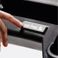 Hand pressing "run free" button on black and gray KICKR RUN smart treadmill control panel