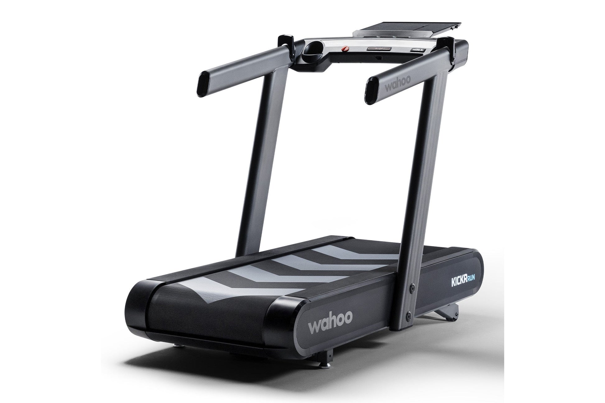 Wahoo KICKR RUN smart treadmill with gray frame, black and gray belt, dual handles, and digital display on white background