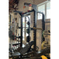 Warrior Elite 1.0 black squat rack with safety bars, weight plate storage, and padded seat in gym setting