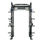 Warrior 2.0 black cable crossover power rack with dual blue pulleys, perforated uprights, multiple weight pegs, and bar stora
