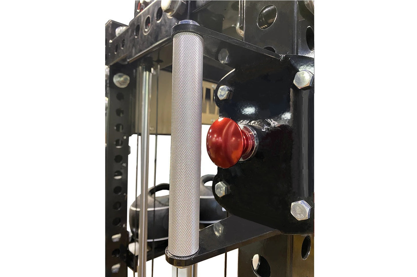 White mesh cylindrical cable guide on black metal pulley system with red lever and chrome hardware, part of gym equipment