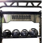 Warrior black and stainless steel cable crossover pulley power rack with four medicine balls displaying 6, 8, 10, and 12 lbs 