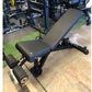 Warrior 2.0 flat incline decline weightlifting bench with black and blue padded seat, adjustable backrest, and leg extension 
