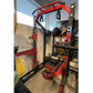 Red and black Warrior Elite 3.0 Power Rack with pull-up bar, weight plate storage, and resistance bands attached, displayed i